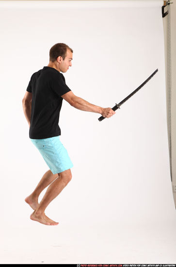 Man Adult Athletic White Fighting with sword Moving poses Sportswear