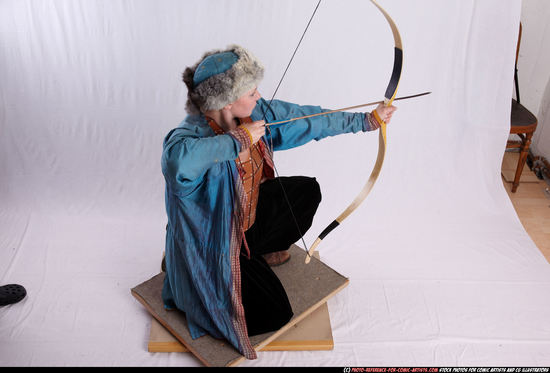 Woman Adult Average White Fighting with bow Kneeling poses Army