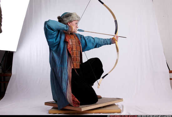 Woman Adult Average White Fighting with bow Kneeling poses Army