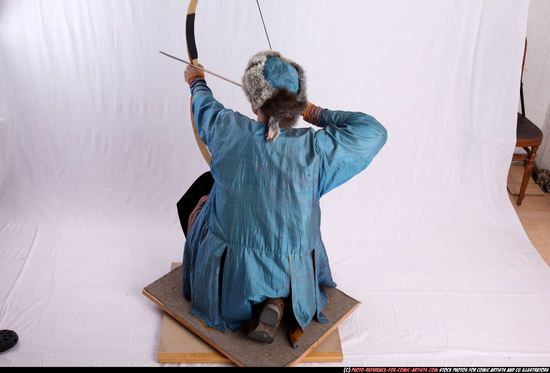 Woman Adult Average White Fighting with bow Kneeling poses Army