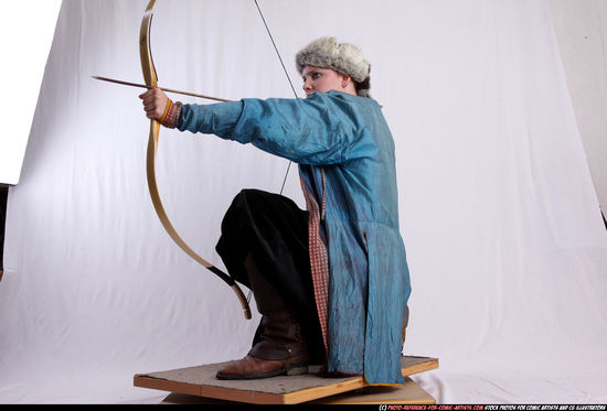 Woman Adult Average White Fighting with bow Kneeling poses Army