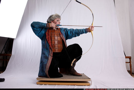 Woman Adult Average White Fighting with bow Kneeling poses Army