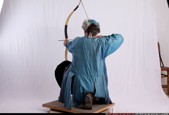 Woman Adult Average White Fighting with bow Kneeling poses Army