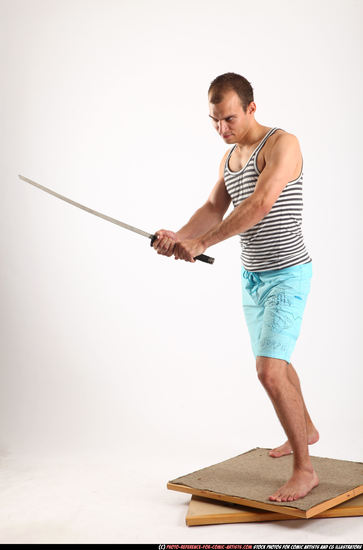 Man Adult Muscular White Fighting with sword Standing poses Sportswear