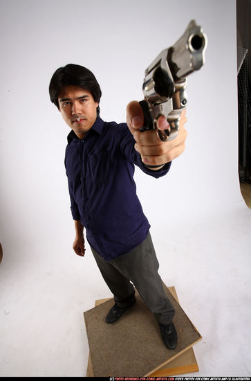 Man Adult Average Fighting with gun Standing poses Business Asian