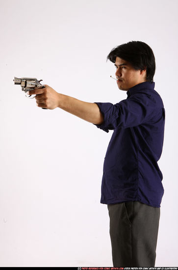 Man Adult Average Fighting with gun Standing poses Business Asian