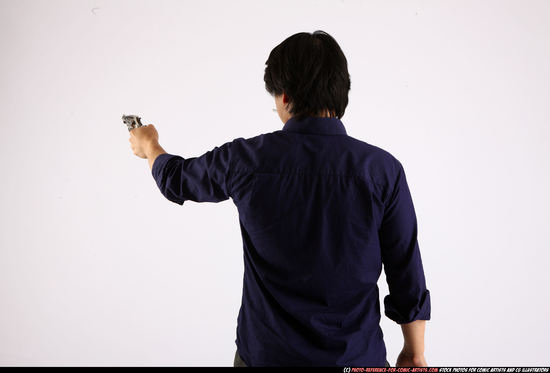 Man Adult Average Fighting with gun Standing poses Business Asian