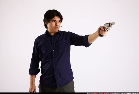 Man Adult Average Fighting with gun Standing poses Business Asian