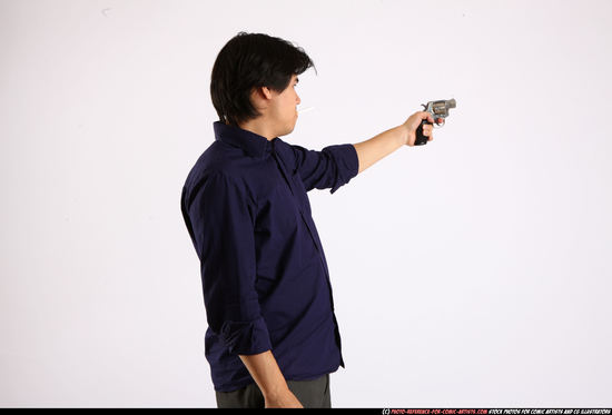 Man Adult Average Fighting with gun Standing poses Business Asian