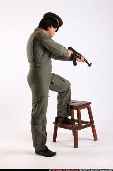 Man Adult Average Fighting with submachine gun Standing poses Army Asian