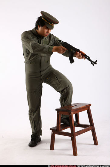 Man Adult Average Fighting with submachine gun Standing poses Army Asian