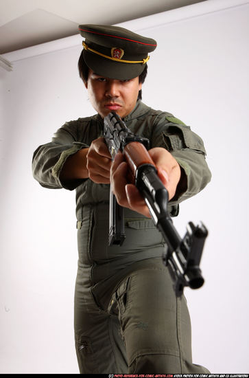 Man Adult Average Fighting with submachine gun Standing poses Army Asian