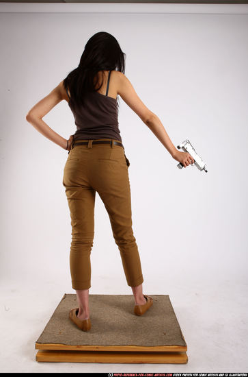 Woman Young Athletic Fighting with submachine gun Standing poses Army Asian