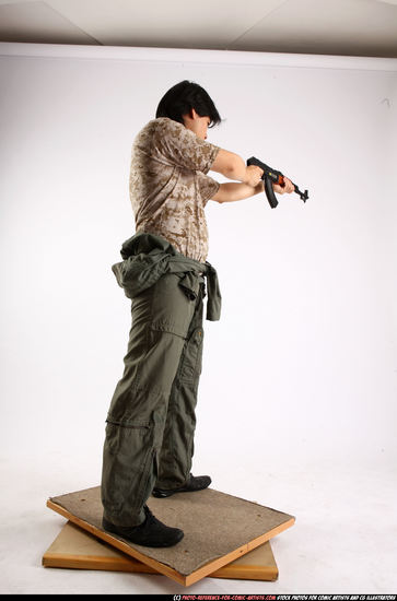 Man Adult Average Fighting with submachine gun Standing poses Army Asian