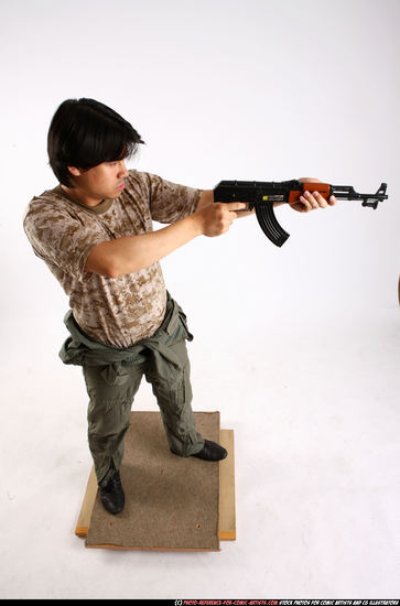 Man Adult Average Fighting with submachine gun Standing poses Army Asian