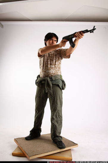 Man Adult Average Fighting with submachine gun Standing poses Army Asian