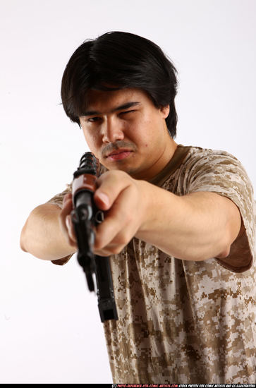 Man Adult Average Fighting with submachine gun Standing poses Army Asian