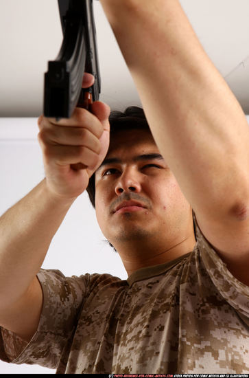 Man Adult Average Fighting with submachine gun Standing poses Army Asian