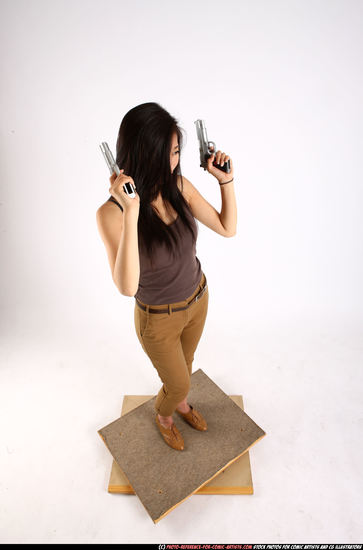 Woman Young Athletic Fighting with gun Standing poses Casual Asian