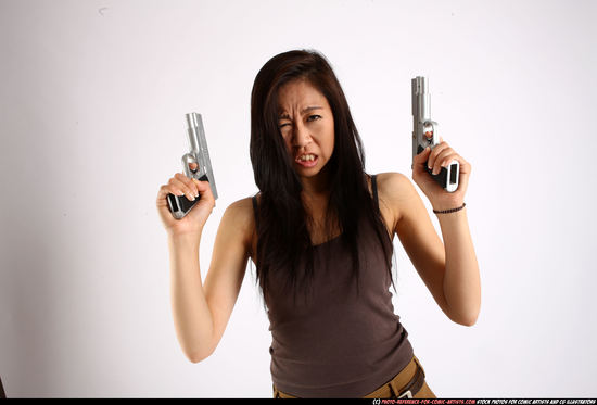 Woman Young Athletic Fighting with gun Standing poses Casual Asian