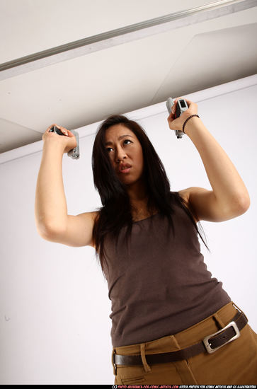 Woman Young Athletic Fighting with gun Standing poses Casual Asian