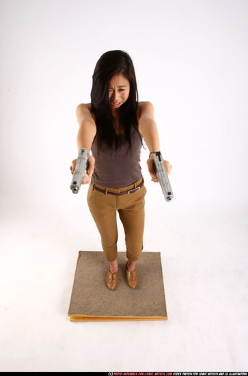 Woman Young Athletic Fighting with gun Standing poses Casual Asian