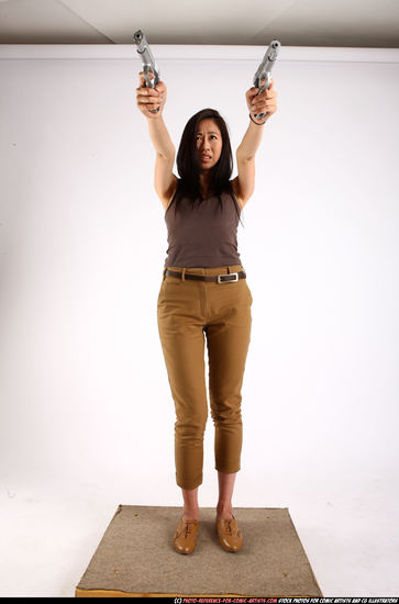 Woman Young Athletic Fighting with gun Standing poses Casual Asian