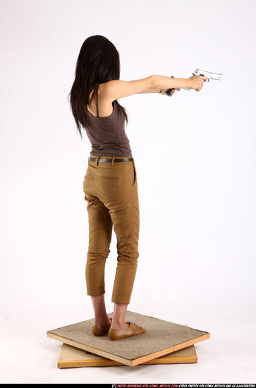 Woman Young Athletic Fighting with gun Standing poses Casual Asian