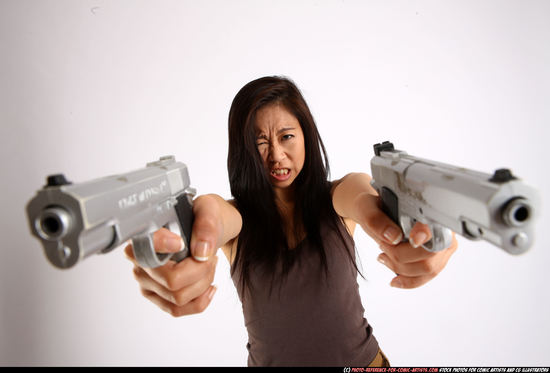 Woman Young Athletic Fighting with gun Standing poses Casual Asian