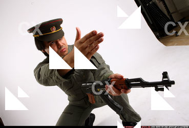 Man Adult Average Fighting with submachine gun Kneeling poses Army Asian