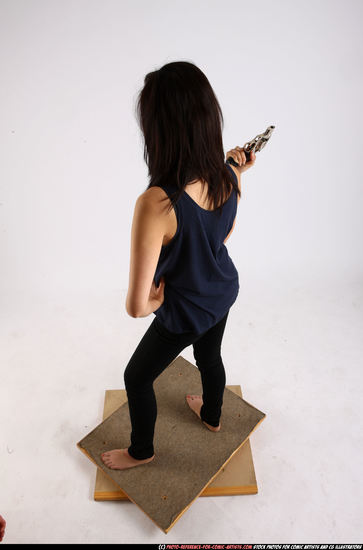 Woman Young Athletic Fighting with gun Standing poses Casual Asian