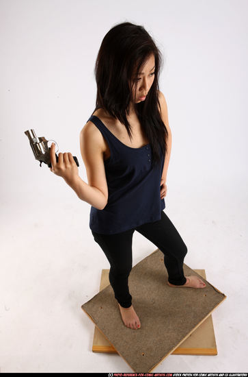 Woman Young Athletic Fighting with gun Standing poses Casual Asian