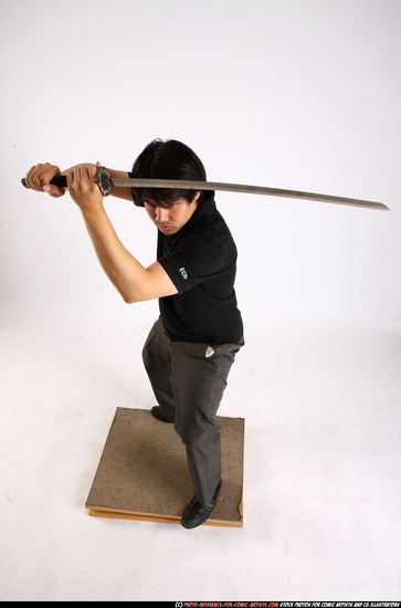 Man Adult Average Fighting with sword Standing poses Casual Asian