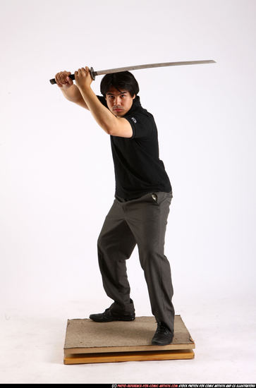 Man Adult Average Fighting with sword Standing poses Casual Asian