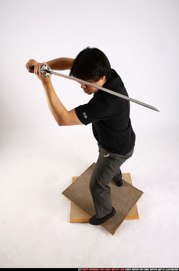 Man Adult Average Fighting with sword Standing poses Casual Asian