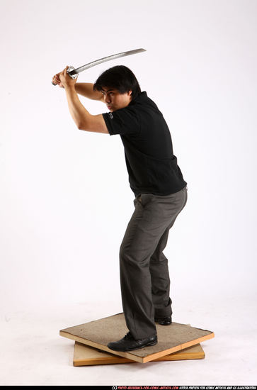 Man Adult Average Fighting with sword Standing poses Casual Asian