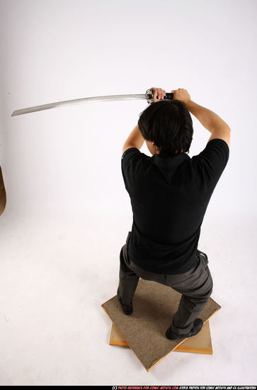 Man Adult Average Fighting with sword Standing poses Casual Asian