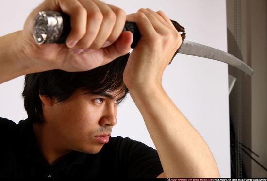 Man Adult Average Fighting with sword Standing poses Casual Asian