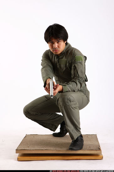 Man Adult Average Fighting with gun Kneeling poses Army Asian