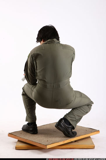 Man Adult Average Fighting with gun Kneeling poses Army Asian