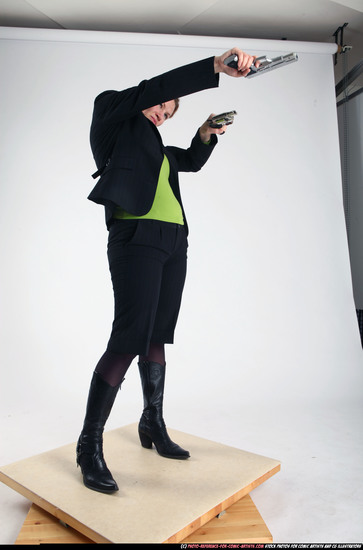 Woman Adult Average White Fighting with gun Standing poses Business