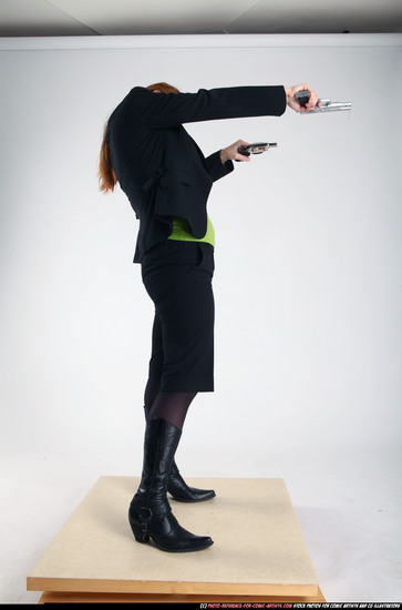 Woman Adult Average White Fighting with gun Standing poses Business