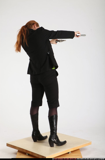 Woman Adult Average White Fighting with gun Standing poses Business