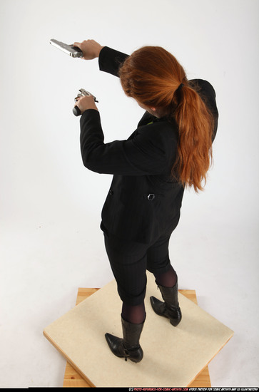 Woman Adult Average White Fighting with gun Standing poses Business