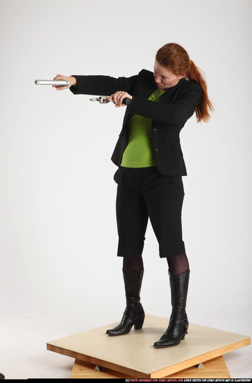 Woman Adult Average White Fighting with gun Standing poses Business