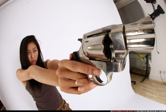 Woman Young Athletic Fighting with gun Standing poses Casual Asian