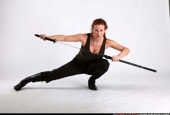 Woman Adult Athletic White Fighting with sword Kneeling poses Casual