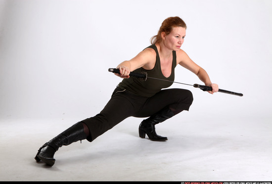 Woman Adult Athletic White Fighting with sword Kneeling poses Casual