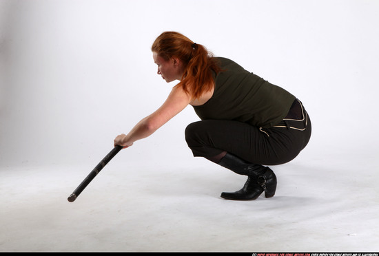 Woman Adult Athletic White Fighting with sword Kneeling poses Casual