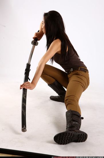 Woman Young Athletic Fighting with sword Kneeling poses Casual Asian